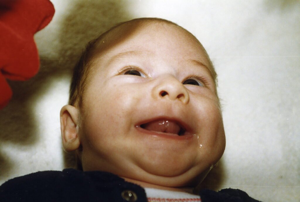 2 months old, smiling