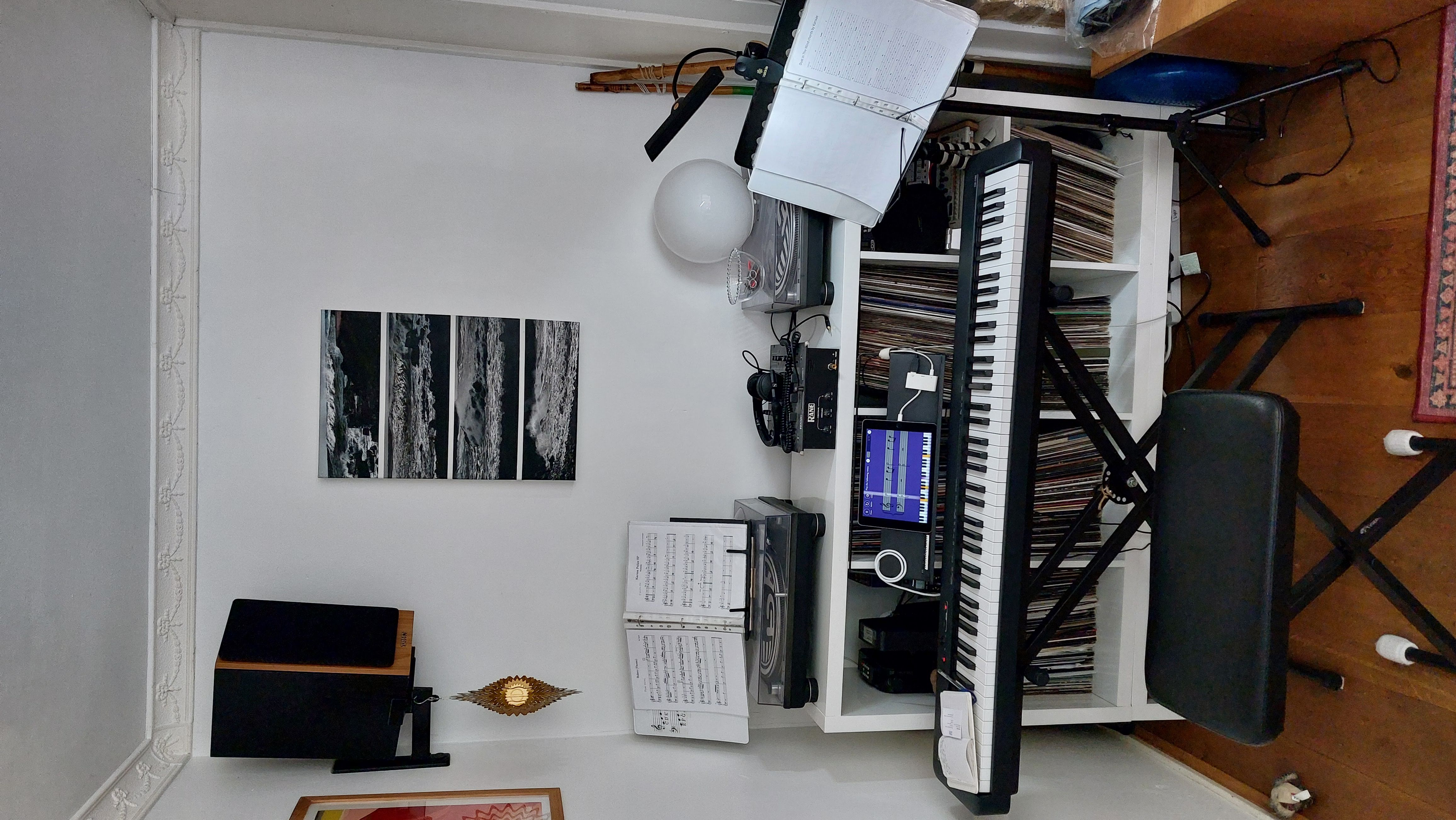 Shared, cluttered space for keyboard and DJ booth