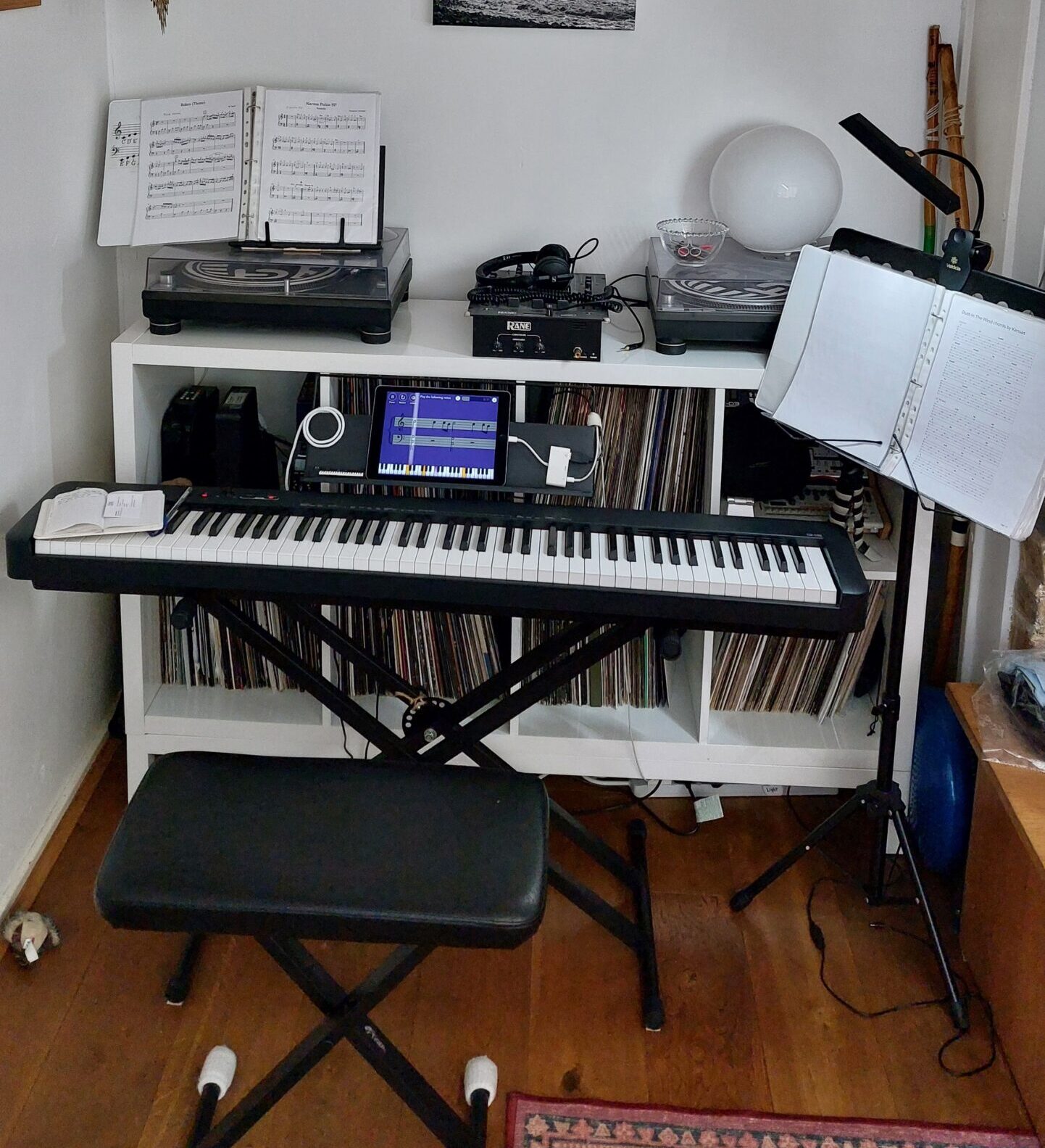 Shared, cluttered space for keyboard and DJ booth